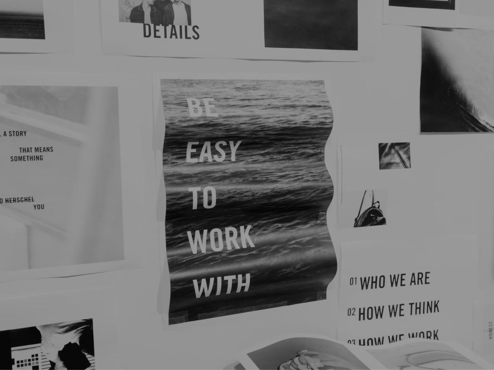 A studio wall of pinned work reading Be easy to work with